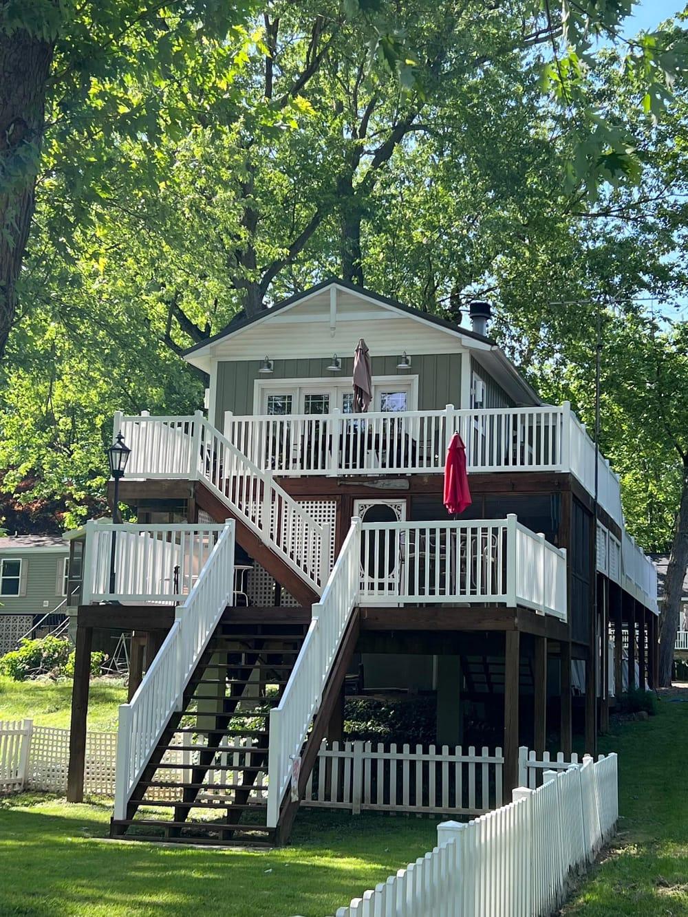 White deck railing on a two-story staircase