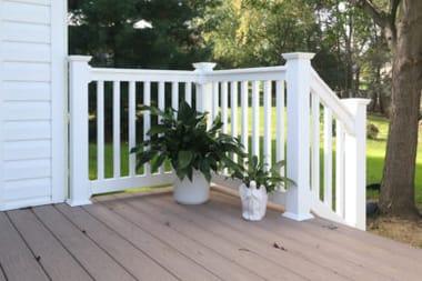 White railing on a backyard deck