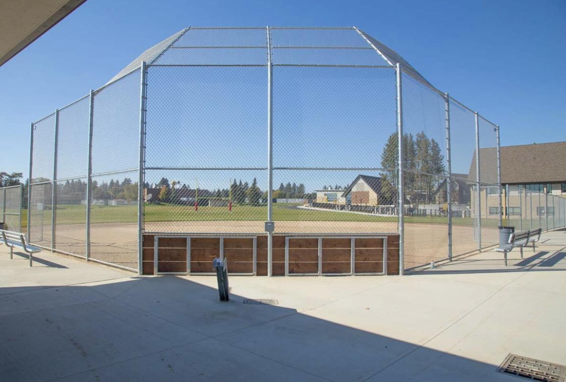 Ballfield backstop fencing enclosure